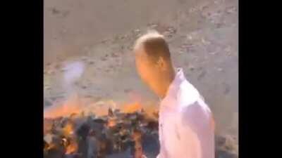 BBC reporter struggles to maintain composure after inhaling fumes from burning narcotics.