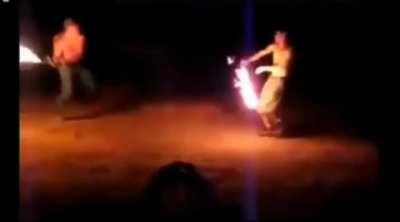 Flaming sword fight that looks like something out of starwars