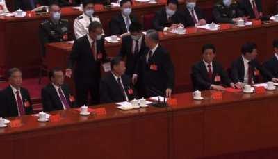 Reluctant-to-leave Former Chinese President Hu Jintao being forcefully removed from Congress in front of Xi Jinping
