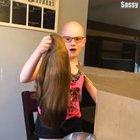 Girl puts her first wig on while battling alopecia areta