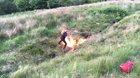 Kids throwing a homemade Molotov into a stream then lighting it manually