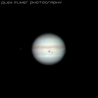 Jupiter's System: Ganymede and Europa transiting, Io getting out of the shadow