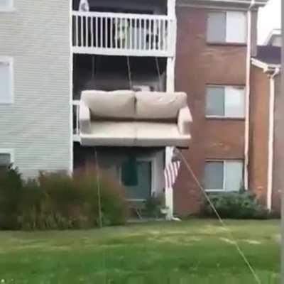 Moving couch off top floor.