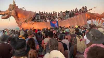 On Friday in the middle of the Playa at Burning Man, over 1000 TOOL fans took a break from the electronic music to enjoy the entire album. Look closely to see Alex Grey himself rocking out super hard in the white next to his artwork. This was absolutely a