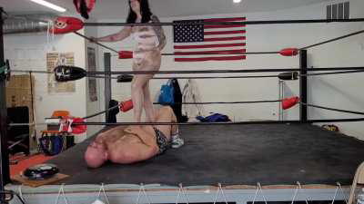 Kisa Kicks femdom wrestling and ballbusting in a shiny new Onsie!