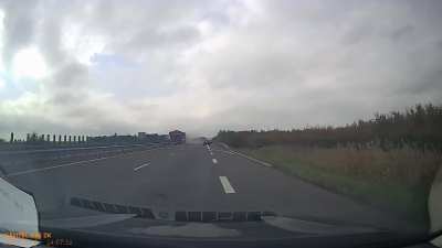 Truck crashes into barrier and crosses into oncoming traffic