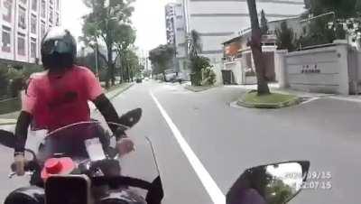 Idiot biker causing Head on collision