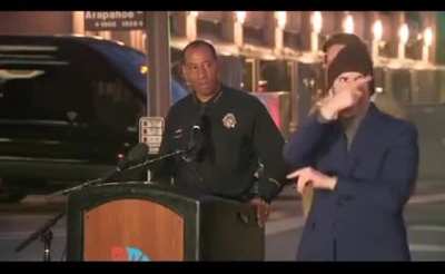 Sign language interpreter doesn’t miss a beat when the Mayor of Denver gets heckled