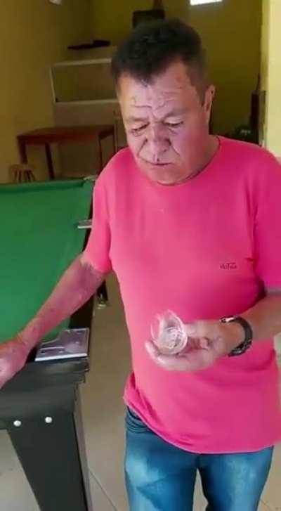 Watch this dude eat half a glass of glass