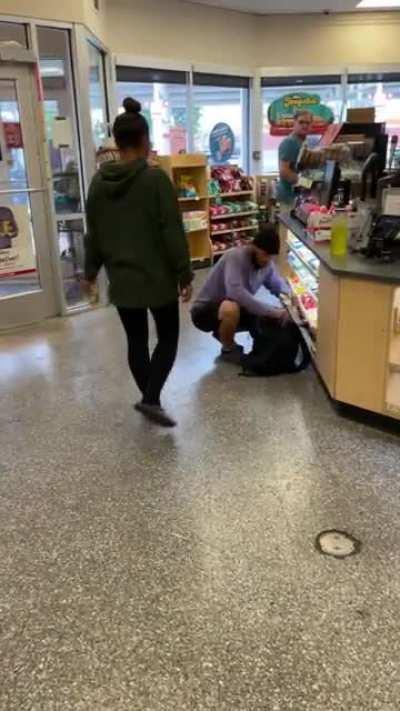 Dude wiping out the Wawa candy supply