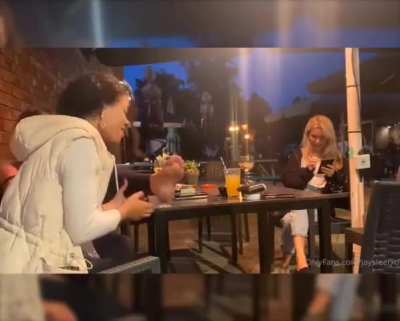 Sucking her friends feet at the bar