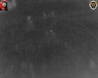 A Russian infantry squad is hit by a Ukrainian 155mm cluster shell, with one submunition landing next to them and causing casualties. The empty cluster shell itself can be seen landing some distance away at top right, having dispensed its load of bomblets