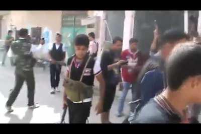 Opposition fighters two-man an HMG to sling single shots at Syrian Army positions - 10/27/2012