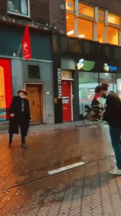 Just an old man vibing to a musician on the street