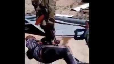 Infamous footage from sadistic Russian Wagner mercenaries brutally torturing and burning Syrian civilian Hamadi Taha Al-Boutah.