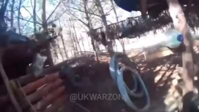 Ukrainian soldier takes out a Russian drone with his double barrel shotgun. Unknown location.