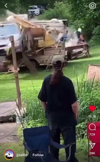 Someone attempts to hit a One Winged Angel or something through a table off the top of a RV as a car proceeds to crash through it