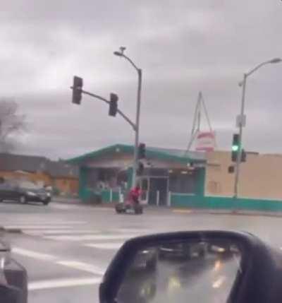 ATV rider shuts down an intersection in Oakland California