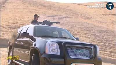 President of Turkmenistan blows shit up from his Denali with a minigun.