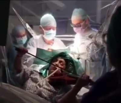 [2020] Dagmar Turner is woken up in the middle of brain surgery to play the violin to ensure the parts of her brain responsible for intricate hand movements weren't affected by the surgery.