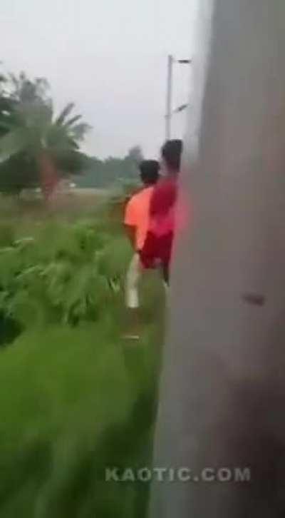 Hanging from a moving train