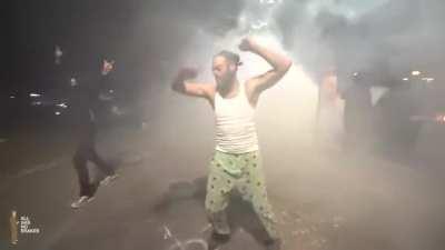 He's just vibing to the beat of the riot