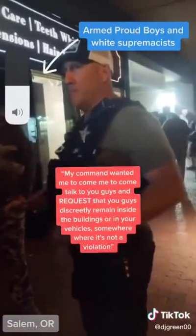 POLICE OFFICER TELLS PROUD BOYS TO HIDE INSIDE BUILDING BECAUSE THEY'RE ABOUT TO TEAR GAS PROTESTERS. THE OFFICER SAID HE WAS WARNING THEM 