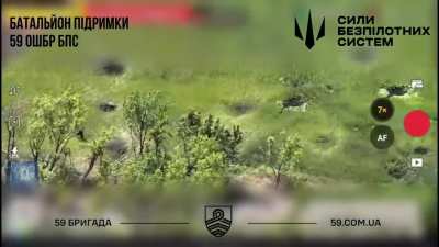 A Ukrainian drone spots a Russian soldier trying to help another Russian soldier get out of barbewire and drops a munition on them.