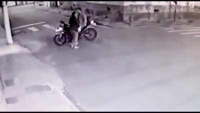 Thieves went to steal a couple's motorcycle in Brazil, but the guy was an off-duty cop.