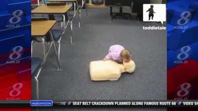 News anchor has laughing fit on air after looking at a baby doing the CPR.