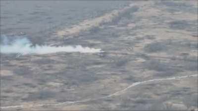 drone footage showing a russian BMP IFV driving over an anti-tank mine and then gets hit by an ATGM missile. [music from source]