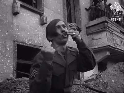 Allied soldier making fun of Adolf Hitler after the allies took control of Berlin [1945]