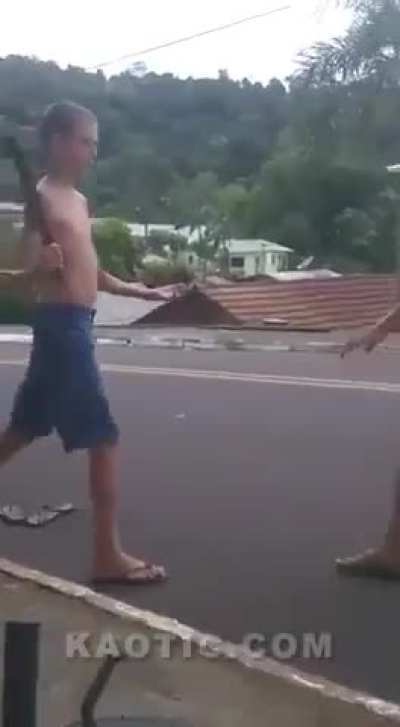 Machete waving guy gets whipped in the face
