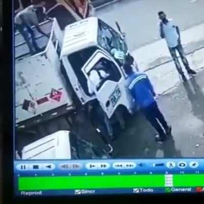 The guy at the top of the truck just saved the life of his friend. If he didn't throw that heavy thing , his friend might get a gunshot.