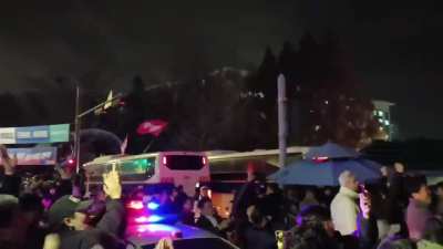 People celebrating as South Korean parliament votes to block Martial Law and soldiers begin to withdraw 