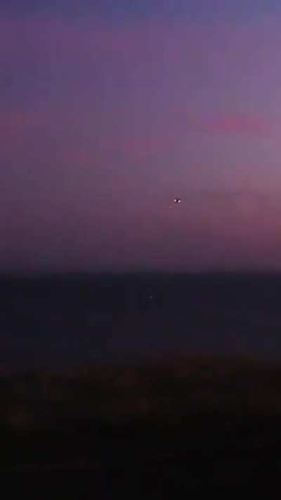 Footage filmed by a by a civilian, probably recorded on a phone, shows a Ukrainian Mi-24 helicopter firing on a Russian / Iranian Shahed-136 drone. Probably Odessa region