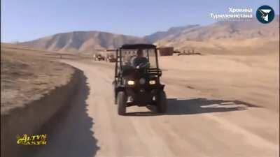 President of Turkmenistan blows shit up from his Denali with a minigun.