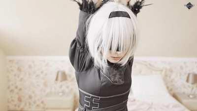 2B from Nier Automata tied up and obediently waiting to be used