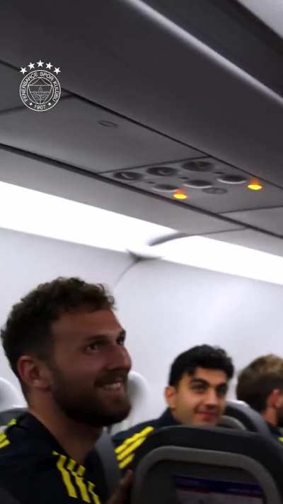 Sadettin Başkan congratulating the players in the plane after the win