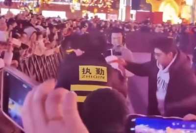 Chinese robot “DongZ272” lashes out at a concert goer.