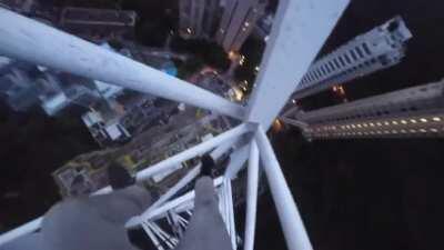 Guy slips and nearly falls on wet Hong Kong crane (Dying Llama)