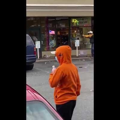 Shop Owner Defends his Store From Looters