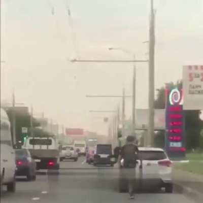 Driver tries to smash bike rider