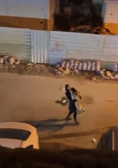 Lady's pet lion gets out and she carries it home like a house cat...