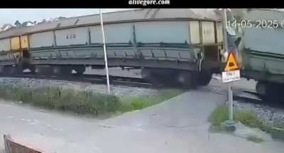 Woman distracted, hit by train. Vietnam