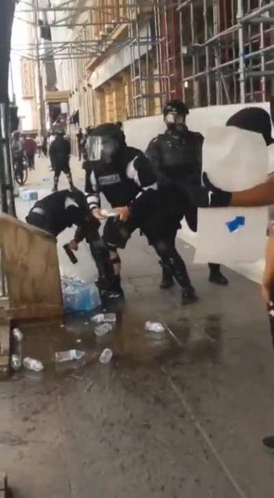 Police are taking peaceful protester's water to prevent them from being hydrated...?