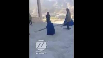 Taliban brutally lashing a woman in Takhar province for going to the shop without a male guardian