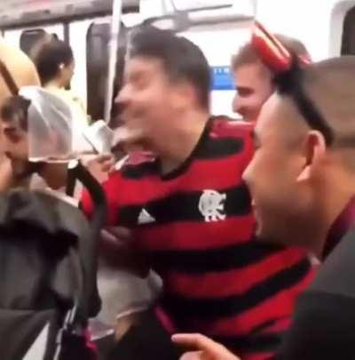 Little girl was crying in the train, these boys decided to make her smile and sang baby shark with her.