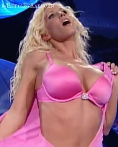 Torrie Wilson showing off her pink bra