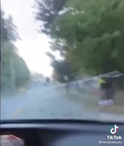 Truck trailer opens up on a hill and dumps steel balls all over the place
